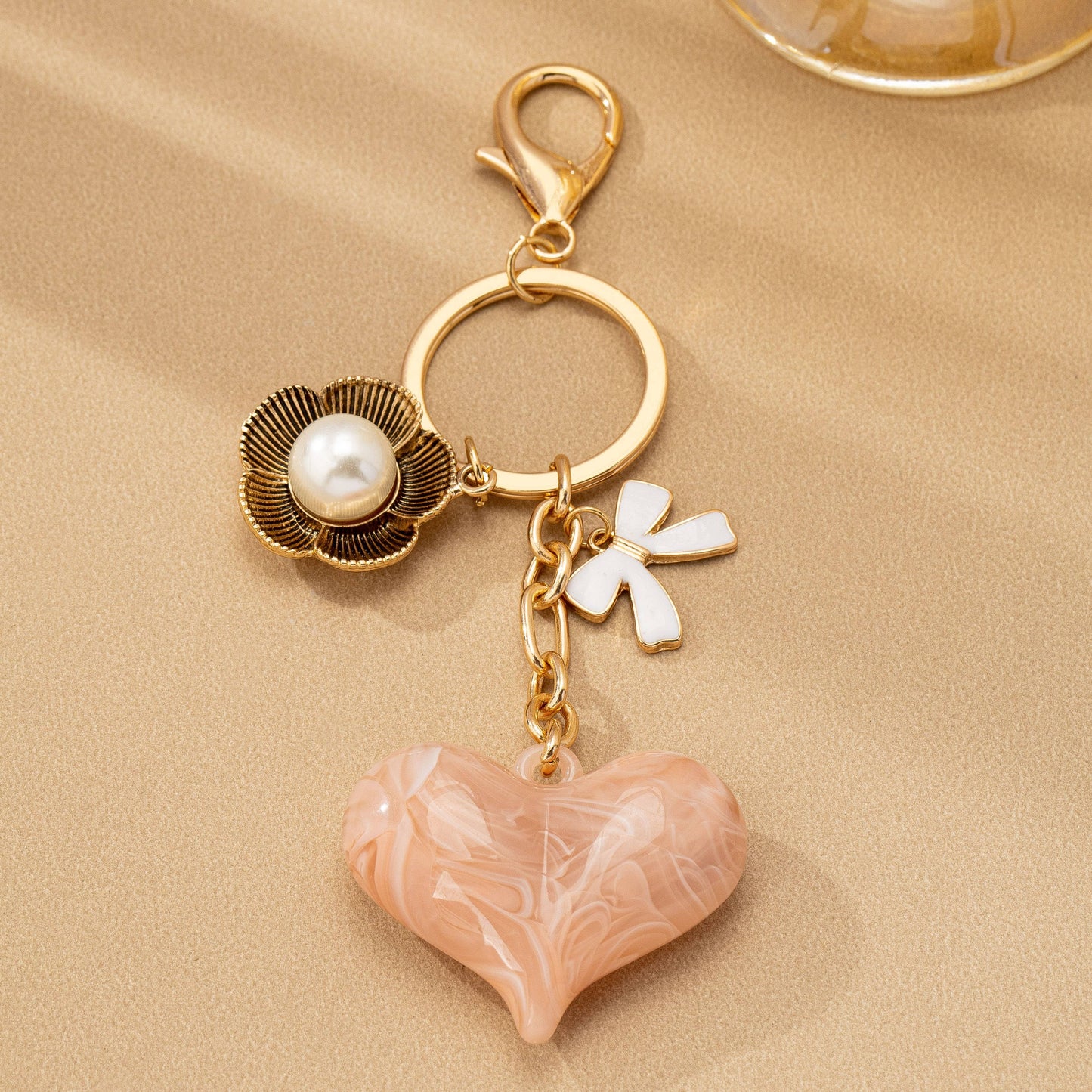 BAG CHARM HEART PERAL FLORAL BOW | 80K090